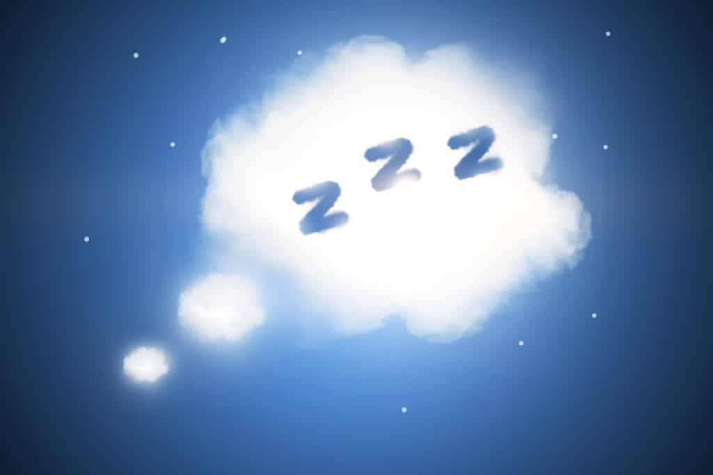 a cloud in the night sky with "zzz" on the inside