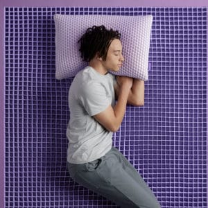 Man sleeping on Purple hybrid Mattress